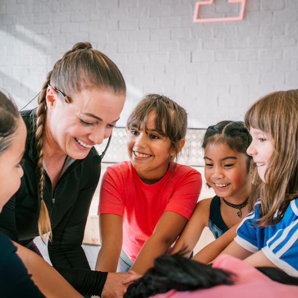 Fitness First children members gathered around their instructor