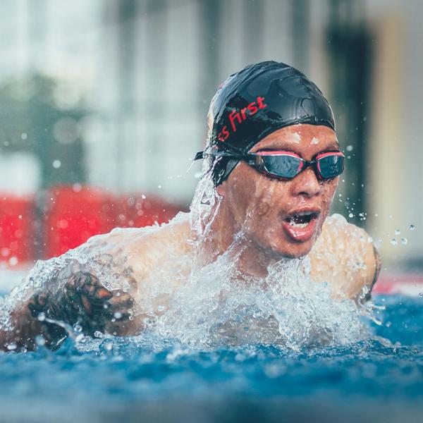 Young man swimming in Fitness First pool Young man swimming in Fitness First pool