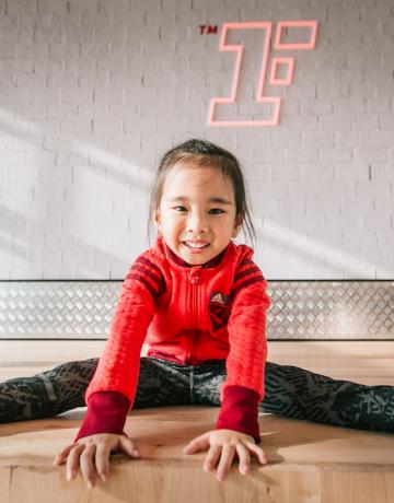 happy junior fitness first member in workout studio happy junior Fitness First member in workout studio