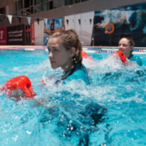 Female Fitness First members during a hydro-combat class