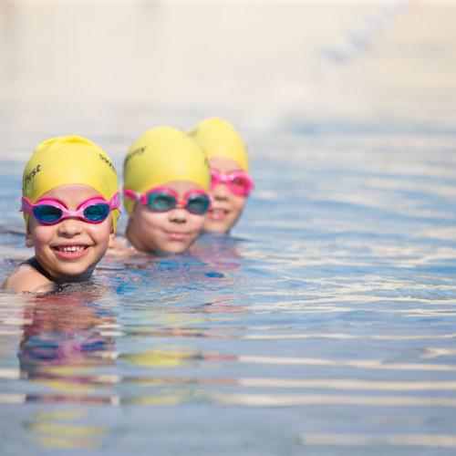 Three children in the swimming pool